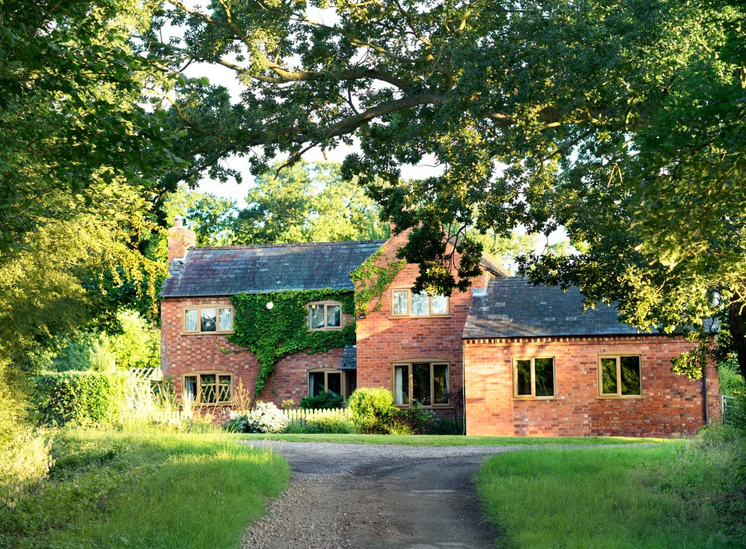 Free Gutter Service Estimate in Surrey Large heritage home with gutters and pitched roof