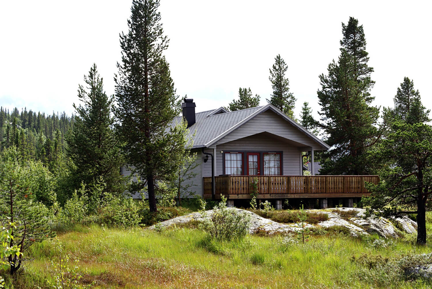 Gutter Services FAQ Pitt Meadows Stone building with multiple dormer windows and tower.