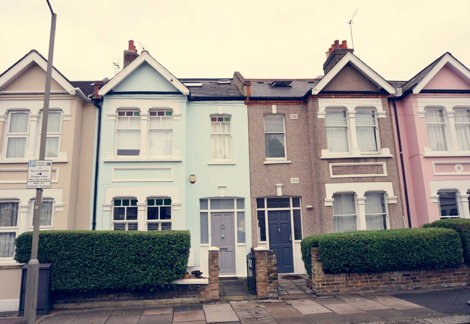 Surrey Gutter Installation & Repair Row of colorful Surrey houses with gutters