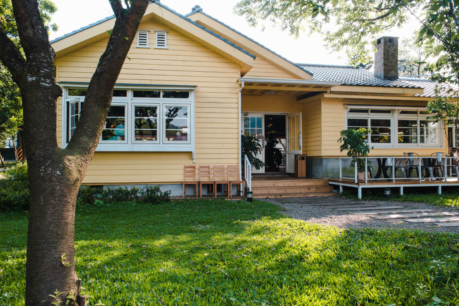 Free Gutter Estimate in Mission Yellow house with gutters and front yard
