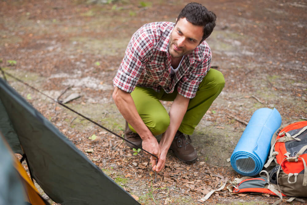 Professional cleaning leaves and debris from residential gutters to maintain proper drainage and prevent water damage to the home
